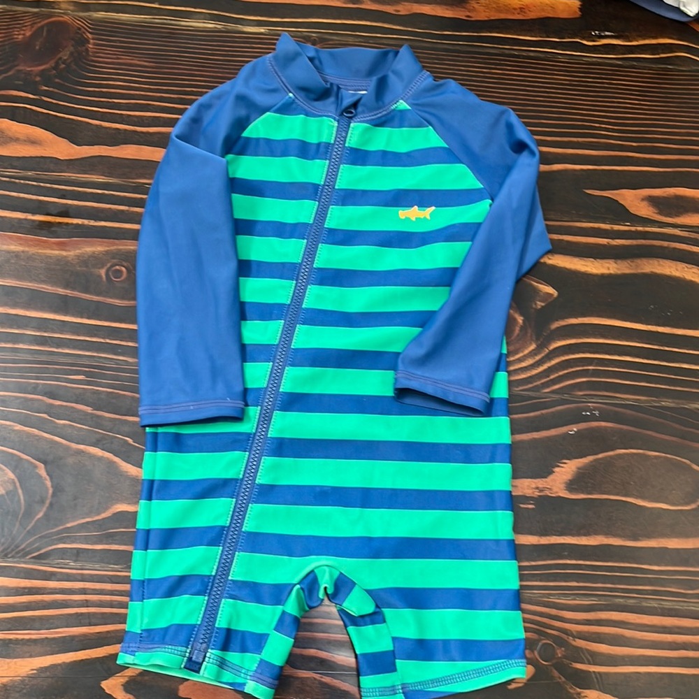Carters long sleeved rash guard. Zips to bottom- awesome for diaper changes!